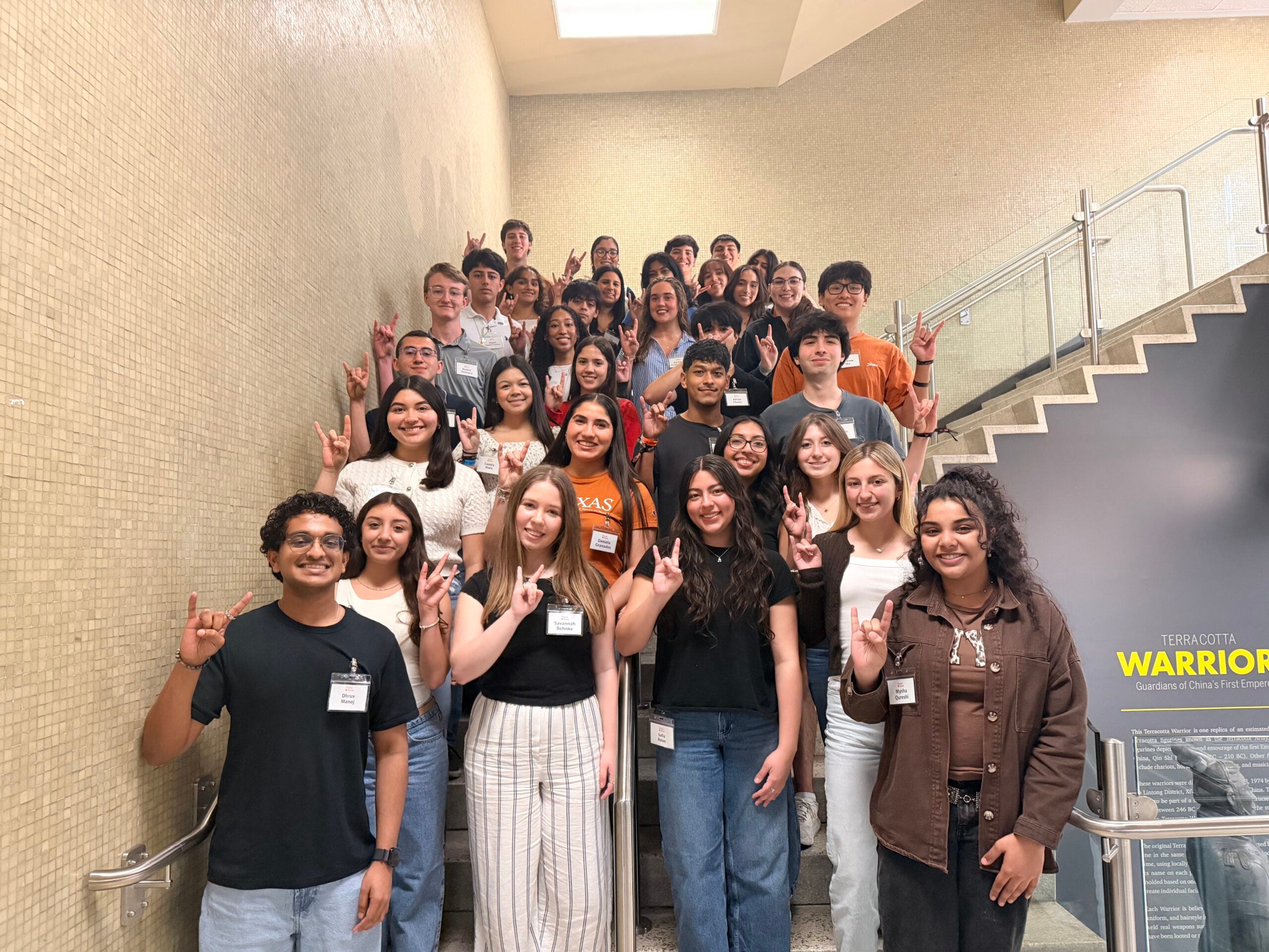 image of a group of students standing on the stairs for a group photo