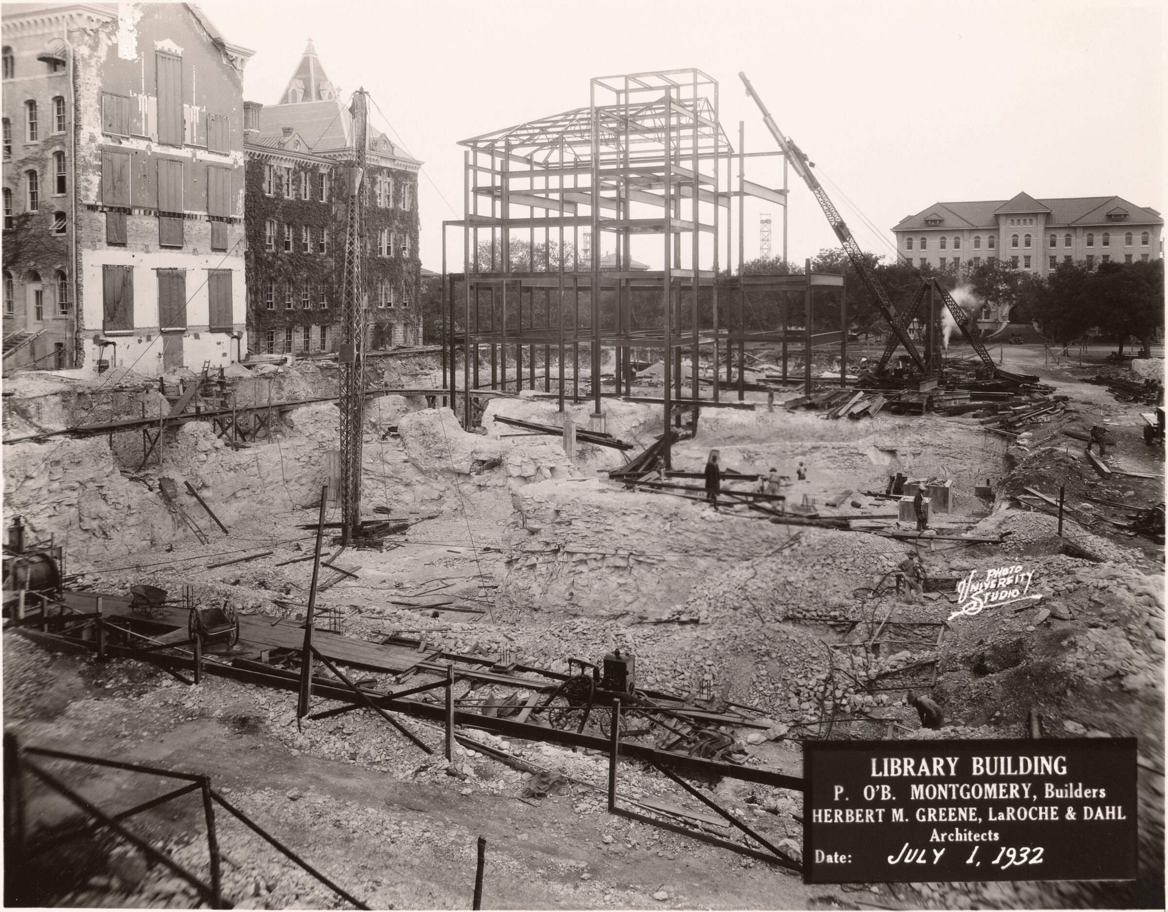 Wide shot of Main building under construction, an excavation pit