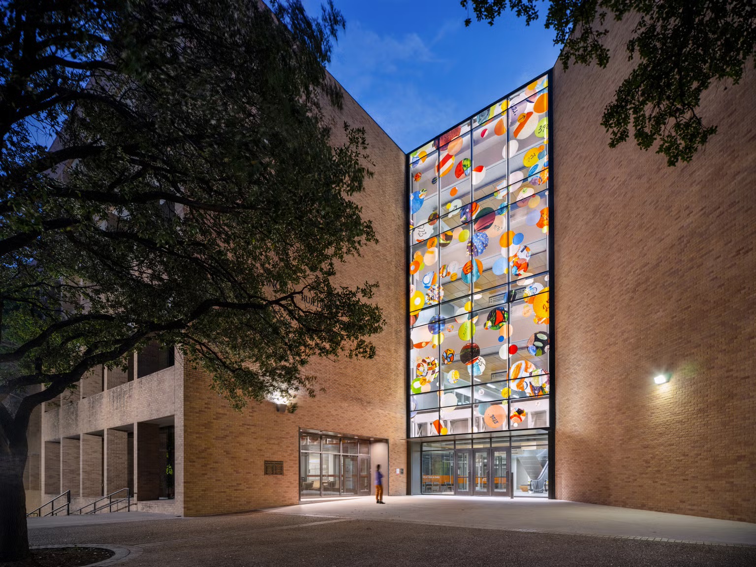 image of a public artowkr featuring circles on a building's windows