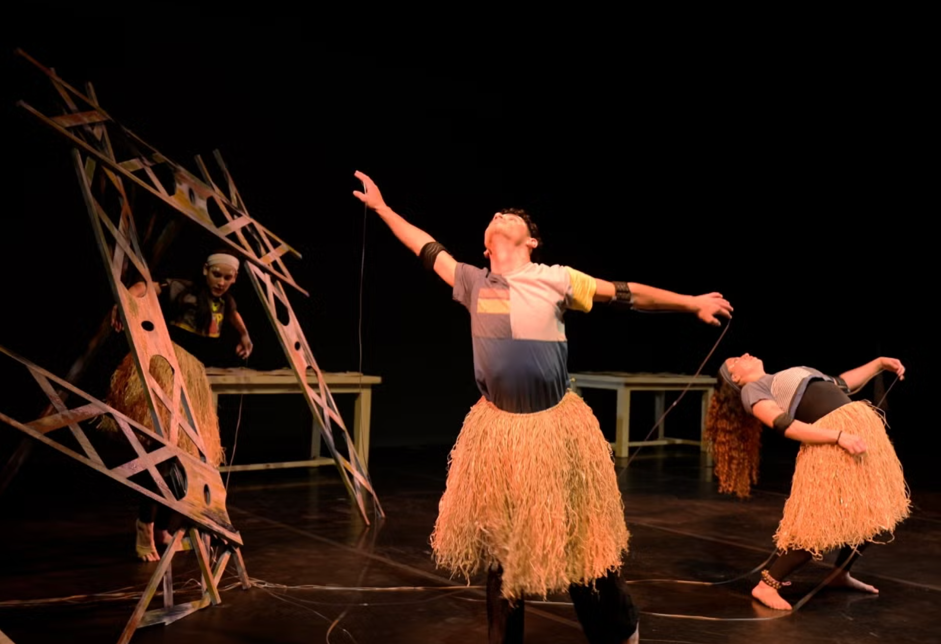 Students dance on stage in costume