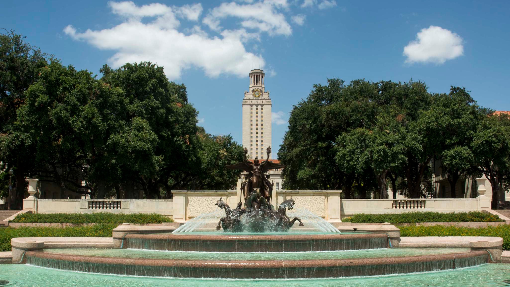 Photo of the Littlefield Fountain and the Tower on the University of Texas at Austin campus.