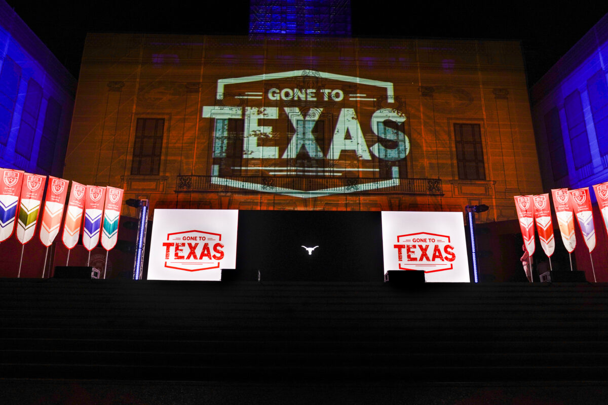 image of a stage with projections that say Gone to Texa