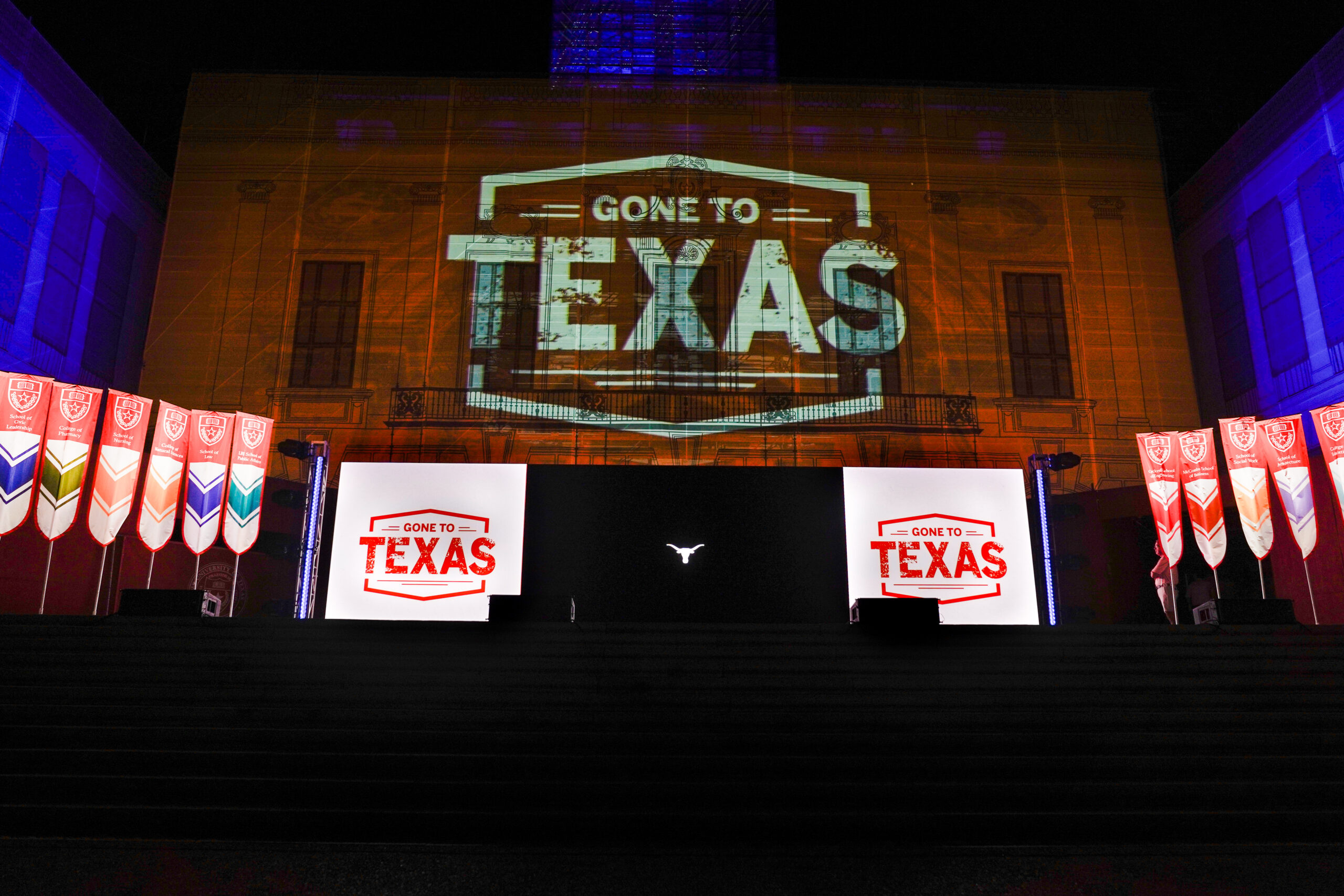 image of a stage with projections that say Gone to Texa