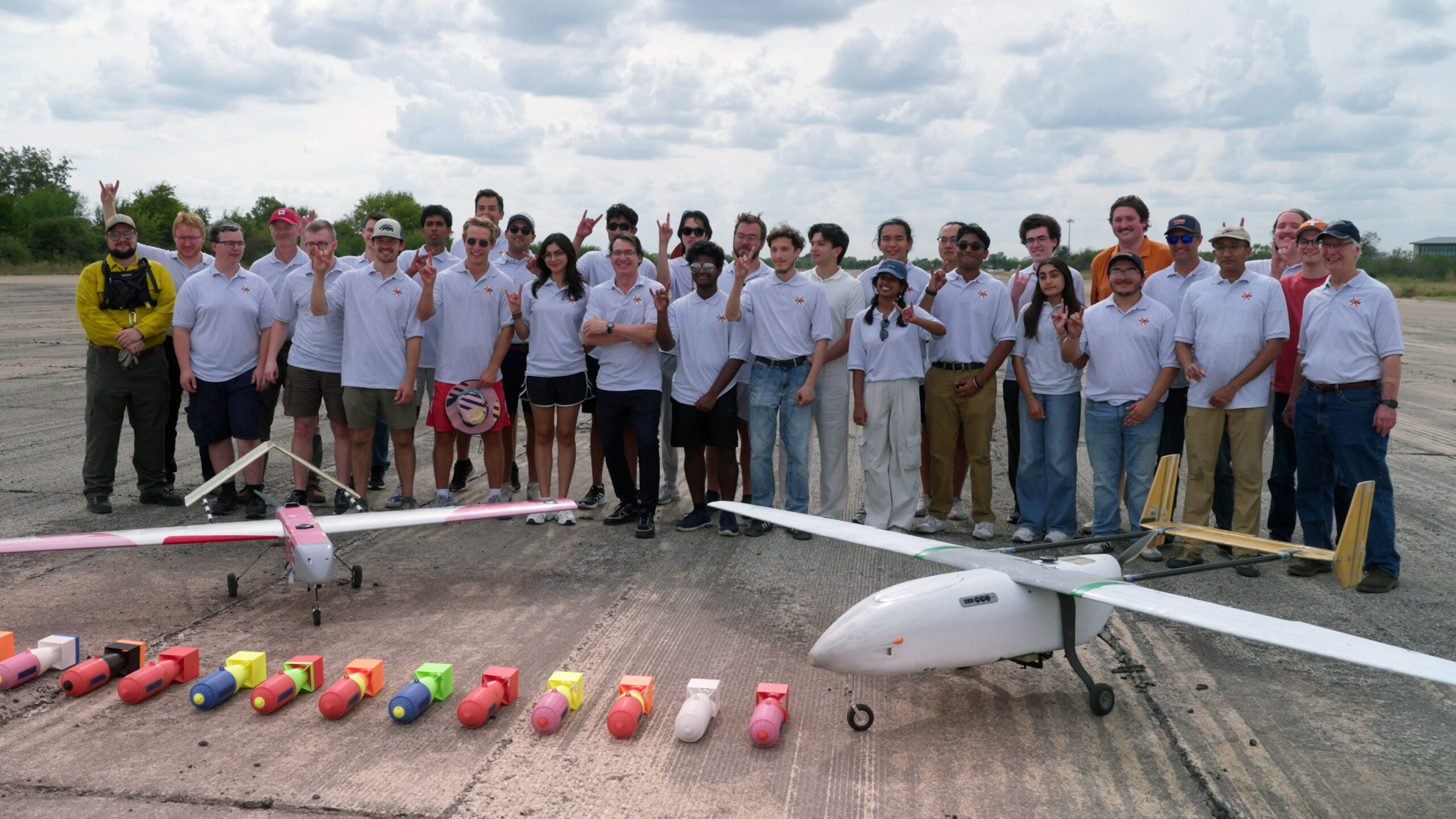 image of a group of students in front of a small aircraft