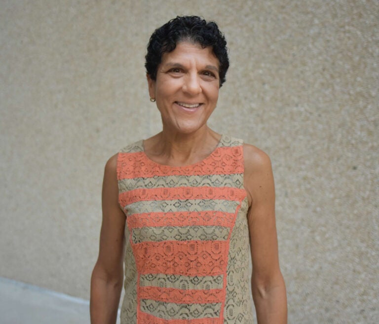 woman wearing an orange and green shirt