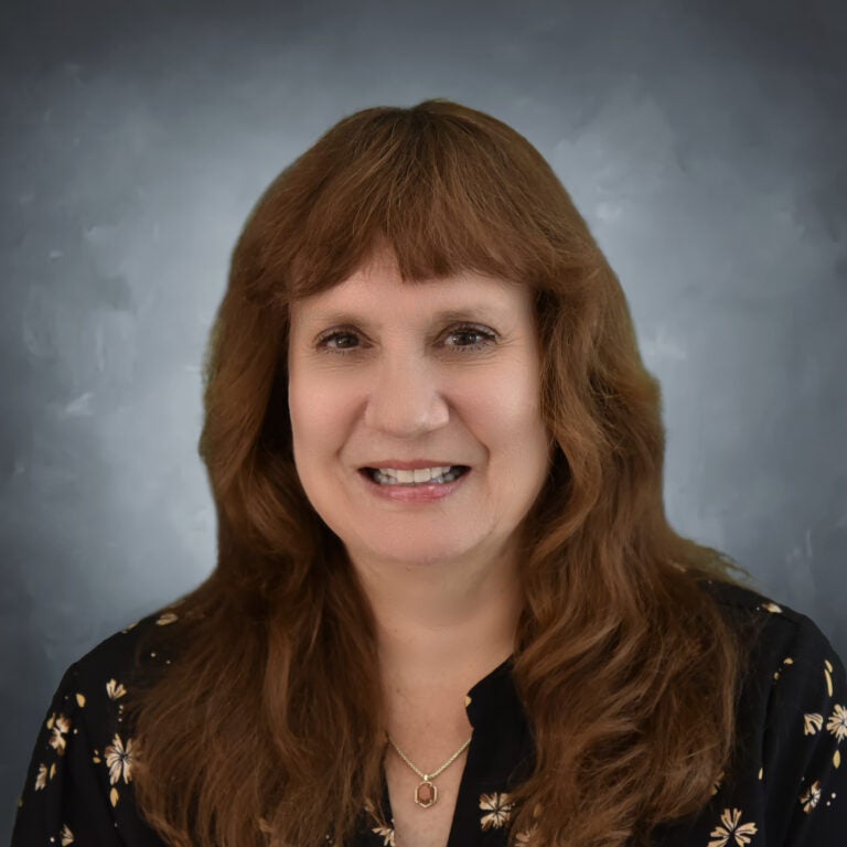 woman wearing a black floral shirt