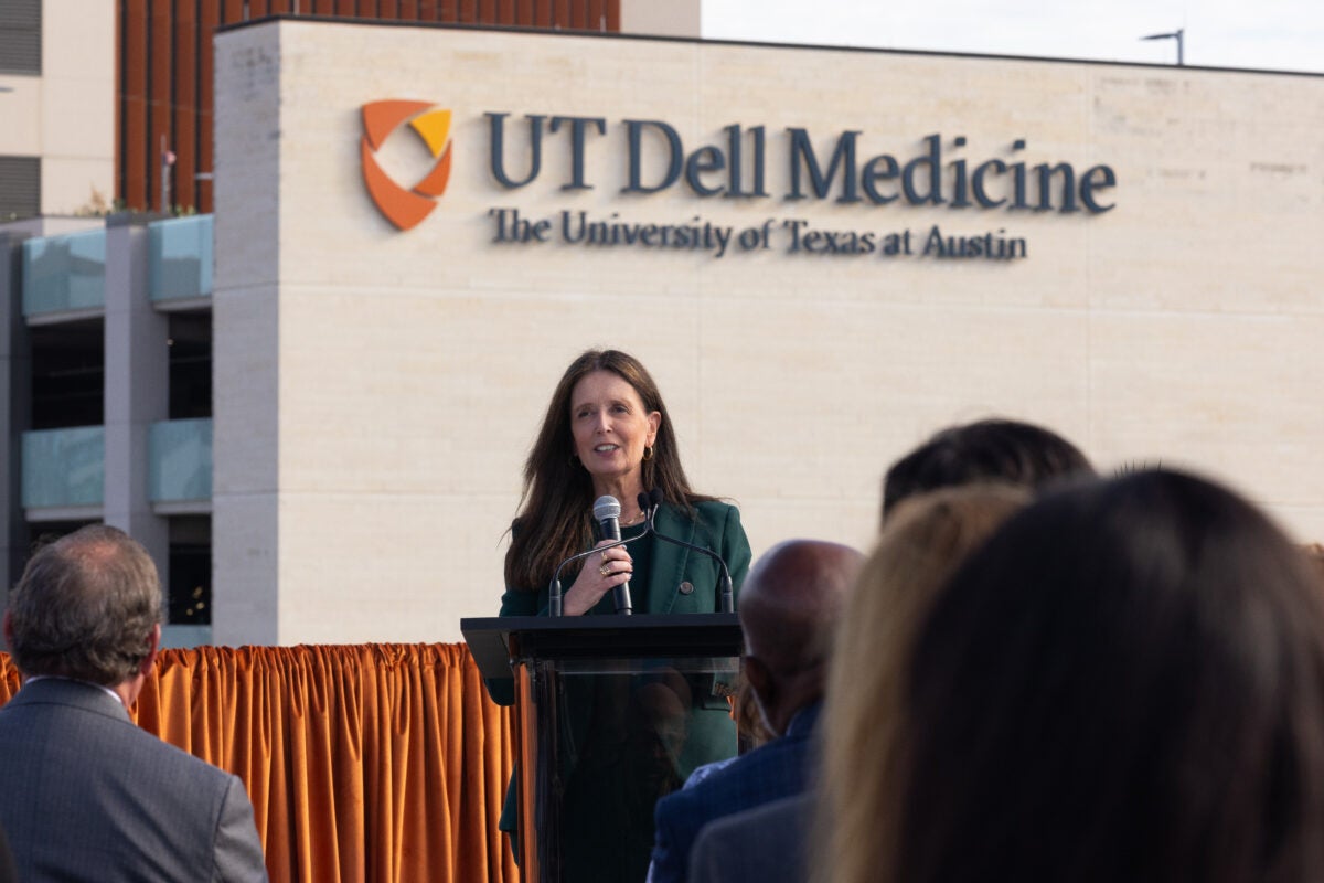 Claudia Lucchinetti, M.D., UT’s executive vice president for medical affairs and the executive leader of UT Dell Medicine, faces a crowd at a press confrence.